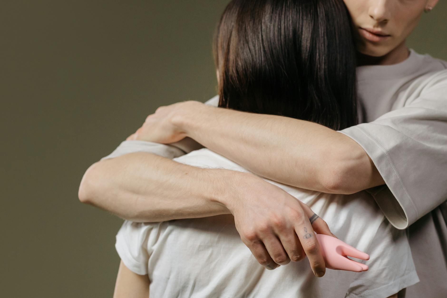 A couple embracing with vulnerability and trust, showing intimacy and emotional connection.